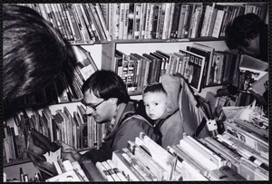 Newton Free Library, Newton, MA. Communications & Programs Office. Man, child - book sale