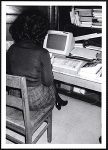 Newton Free Library, Newton, MA. Communications & Programs Office. Woman at computer