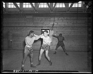 Three men boxing