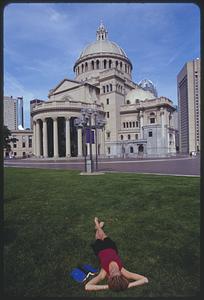 Woman on lawn in front of Mother Church, Church of Christ, Scientist