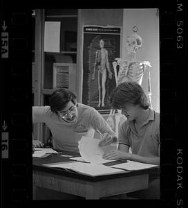 A student being taught in science classroom