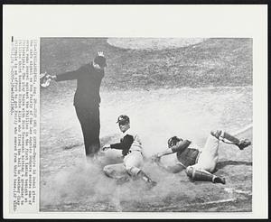 Just One of Seven--Umpire Ed Sudol gives the safe signal as Ron Fairly of the Los Angeles Dodgers scores on of seven runs scored against the Phillies in the first inning tonight at Philadelphia. The play began with Dick Tracewski hitting a grounder to Phillies third baseman Richie Allen who fired the ball to catcher Clay Dalrymple in an effort to get Fairly who scored from third base.