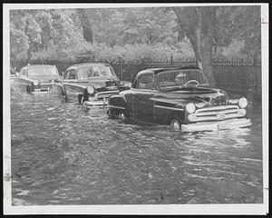 Hub Deep in Hub-Charles street looked as though the dam had burst as a strong current swirled against parked cars.