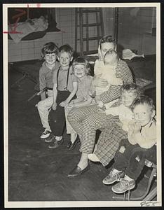 Hough's Neck, Quincy, mother Mrs. James Dennis and her six children were evacuated from their Turner St. home by firefighters and housed in Hough's Neck fire station because of high tide which flooded her home. Mrs. Dennis holds Kimberly, five months. Other youngsters, from left, Kellee, 6, James, 4, Catherine, 7 1/2, Stace, 2, and Timothy, 3.