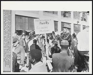 Lansing, Mich. Pickets at Fisher Body – George J. Smith, president, tells Fisher Local No. 652 pickets to keep moving as U.A.W. members walked out of the Fisher Body Division General Motors Lansing plant Friday morning when the U.A.W. and G.M. failed to sign a new contract by a 10 a.m. deadline.