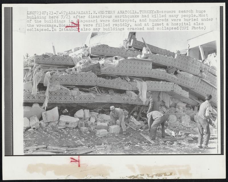 Rescuers search huge building here 7/23 after disastrous earthquake had killed many people. Most of the buildings in Adapazari were destroyed, and hundreds were buried under the wreckage. Hospitals were filled rapidly, and at Izmet a hospital also collapsed. In Istanbul also may buildings cracked and collapsed