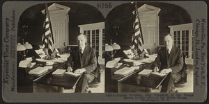 Calvin Coolidge, President of the United States, at his desk