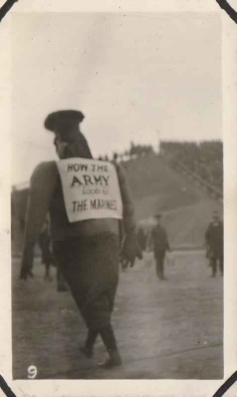 Marines wearing costume with sign "How the Army looks to the Marines," Army-Marine football game, Baltimore, MD, Dec. 2, 1922