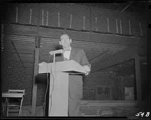 Man talking at a podium