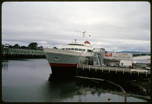 M.V. Coho ferry and sign advertising trips to Port Angeles, Washington, from Victoria, British Columbia