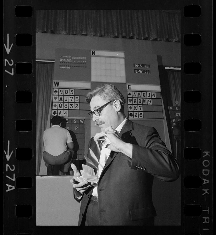 Shuffling the cards at a bridge players convention, Hynes Auditorium