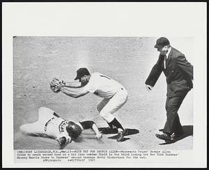 Nice Try for Bernie Allen -- Minnesota Twins' Bernie Allen tries to reach second base on a hit into center field in the third inning but New York Yankees' Mickey Mantle threw to Yankees' second baseman Bobby Richardson for the out.