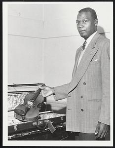 Elwyn Adams. Violinist with instrument presented to him by Queen Elizabeth of Belgium