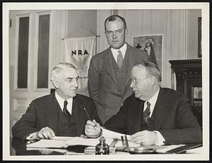 Mayor Frederick W. Mansfield confers in his office with Emergency Campaign heads and gives hearty endorsement of this community effort for 1935. (left to right) Oscar W. Haussermann, general chairman; Paul C. Cabot, chairman of the Industry and Finance Division of the Emergency Campaign: and Mayor Mansfield. Note to Editors:-- The mayor's statement endorsing the campaign is being issued from the Mayor's office.