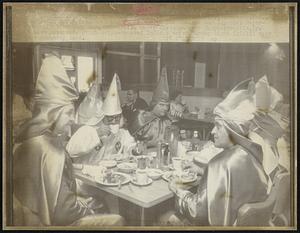 Far left, Grand Dragon of the Ku Klux Klan for Indiana and Imperial Representative for Kentucky, dines with other Klansmen near Shephersville, Ky. A Klan motorcade which criss-crossed Indiana ended Sunday night (10/15) near the Kentucky town.