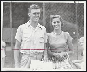 Mr. Tennis and Wife - Mr. and Mrs. Frank Sedgman of Australia pictured yesterday at Longwood as he arrived in preparation for tournament. It's Mrs. Sedgman's first U. S. visit.