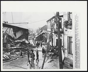 View Quake Devastation -- Residents of Valdivia, in southern Chile, look over wrecked buildings in the wake of the earthquake tremors that caused widespread damage and loss of life in the South American country.