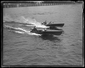 Two speedboats, one called "Airships Baby Buzz"