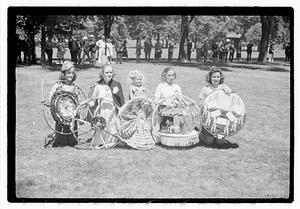 Girls holding decorated hoops