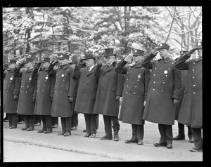 Superintendent Michael Crowley and Commissioner Hultman and officers salute a dead comrade.