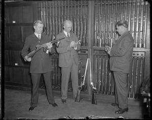 Police mount guard over own arsenal. R-R: John H. Cloran / Francis J. McNeil / Edward J. Siebold.