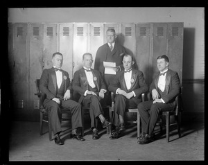 Boston Police Liquor Squad led by Oliver Garrett (second from right) dressed up in evening clothes for visits to Boston hotels on New Year's Eve.