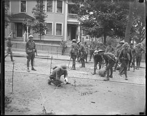 Soldiers set up barbed wire at strike scene in Rhode Island.