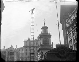 Fireman on ladder next to Old State House during demonstration