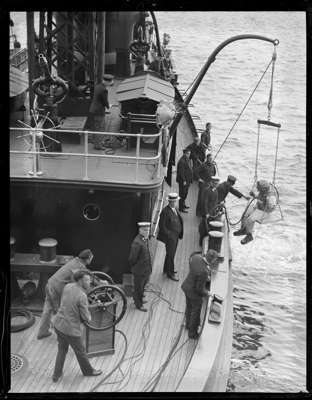 Diver on Matthew J. Boyle Engine 44. Pictured: Fire Commissioner Edward McLaughlin, Superintendent of Maintenance Edward E. Williamson, Master Marine Service John D. McDonough, Captain John E. Williams, Diver Joseph M. McCarthy.