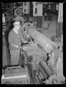 Man working at machine in factory