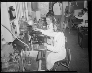 Women and men working in laboratory