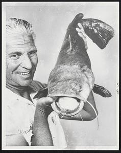 Cate Tale-This 14-pound flathead catfish should have kept his big mouth shit, but then Harold Johnston wouldn’t be wearing the smile in Leavenworth, Kans. doughball for bait, Johnston was fishing small pond when the whopper made a grab