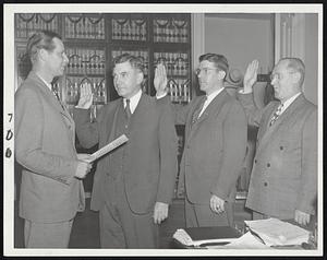 New State Officials-Gov. Tobin, left, swears in three public officials whose appointments were confirmed by the council today: Thomas H. Buckley, commissioner of administration and finance; Patrick A. Tompkins, commissioner of public welfare, and W. Henry Finnegan, member of the Civil Service commission.