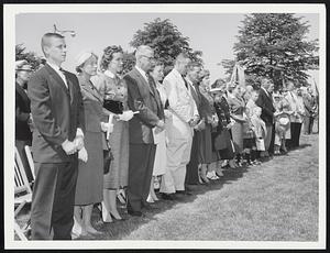 Tobin Statue Unveiled--Relatives and friends of the Labor Secretary Maurice A. Tobin listen to invocation during unveiling of statue in his memory on the Charles River Esplanade. Among them are, left to right, Maurice, Jr., Mrs. Thomas Egan, widow, Carol, daughter, and Mrs. Egan's husband, Thomas.