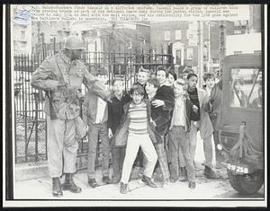 N.Y. Knickerbockers finds himself in a different uniform. Russell holds a group of children back from passing trucks as part of his National Guard duty during the postal strike. Russell was called to duty 3/24 to deal with the mail strike, and his availability for the 3/26 game against the Baltimore Bullets is uncertain.