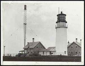 Highland light, on Cape Cod, from which the beams sometimes flash 75 miles and where many visitors ask many questions.