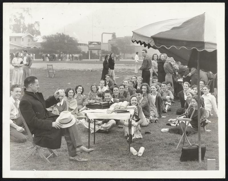 Open Air School Sessions After Quake. For the first time since the California earthquake, Long Beach's 30,000 school children returned to classes April 3, meeting on school grounds, athletic fields, in park and other places. A long Beach High School Class is shown here resuming studies. A plan of homework assignments, aided by newspapers and radio is in effect temporarily until repairs are completed on school buildings which survived the earthquake. Officials estimated two thirds of the structures in the $12,000,000 school system will have to be razed.