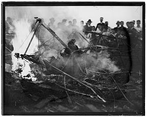 People watching unidentified material on fire