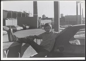 Jimmy Driscoll leaning on a car