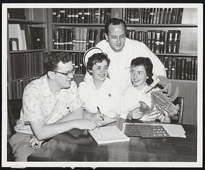 Showing her display for the forthcoming Carney Clambake for staff and personnel of the Carney Hospital is Margaret Crozier, seated with members of the Committee. The Clambake will take place in Scituate on Wednesday evening, June 27th. Making plans are (L. to R.) Edward Logan, Joan Kennedy, R.N., Dr. Antoine Abou-Nassar, and Margaret Crozier.