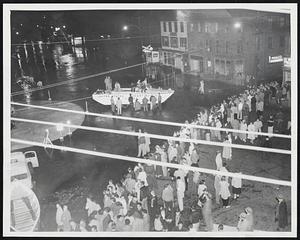 Sightseeing in Peabody-As the waters went down several hours after the dam break, crowd of curious was able to keep feet dry and Coast Guard amphibious craft was operating on wheels. Crowds estimated at 4,000 watched rescue operations during the evening, with officials preparing to handle larger throngs at daylight today.