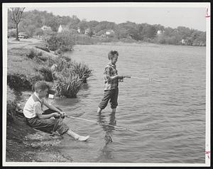 Summer is a Lazy Line--And nobody enjoyed yesterday’s rare June day more than these two young anglers at Horu Pond in Woburn. Left to right, Ronnie McQuilkin and Charles Sullivan, both nine and both of Woburn.