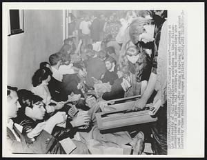 "Culinary workers"--students at the University of California (R) serve sandwiches to their fellow-demonstrators in Sproul Hall corridors, as the demonstrators were locked into the building after stages a day-long sit protest against University rules restricting campus political activity.