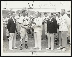 Making His Day Perfect -- Mike Ryba receives the trophy for being the most valuable player in the International league last year after stepping in and stopping the Browns in yesterday's first game at Fenway Park. Left to right -- Joe Cashman, chairman of the Boston Chapter of the National Baseball Writers' Association; Mike, Jack Malaney, representing the Sporting News, which donated the trophy; Stanley W. Ysnioski, Polish consul in Boston, and Eddie Doherty of the Red Sox public relations staff.