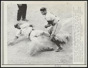 Red Sox-Angeles-Boston- George Scott slides across with what proved to be the winning run as Angels' catcher Bob Rodgers drops ball during 8th inning of game here (8/19). Elston Howard off the Red Sox hit to left fielder Rick Reichart to score two runs, after throw got by Rodgers. Boston won game, 12-11.