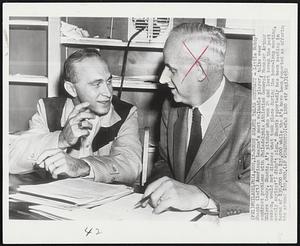 Bobby Shantz Talks Contract - Little Bobby Shantz (left) American League's most valuable player, talks over contract problems with Philadelphia Athletics General Manager Arthur Ehlers today. Shantz, A's pitcher who won 24 and lost seven the past season, would not discuss what took place during the hour-long meeting, merely saying- "I didn't sign." Shantz reportedly has been seeking in terms of $30,000 to $35,000 while the A's have been reported as offering him around $20,000.