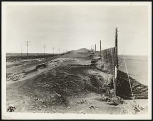 Dust Storm Leaves Small Hills in Wake. Piles of dust were scattered across Kansas and neighboring states when recent storm subsided after blowing while sun shone and the temperature was high. This picture taken near Colby, Kan., shows barrier erected to keep back snowdrifts nearly covered by dust.