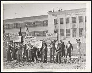 CIO Men Parade at Curtiss Plant After an executive session of the United Automobile Workers-C.I.O. convention thousands of delegates visited the vicinity of two Curtiss-Wright corporation airplane plants in this area in effort to spread the union message to 17,000 employes, many of whom are members of an independent union. The convention delegates are shown in front of the Curtiss plant at Buffalo airport.