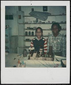 Jr and Suzy posing with projects in the clay room