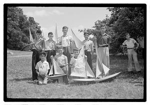 Boys posing with model sailboats